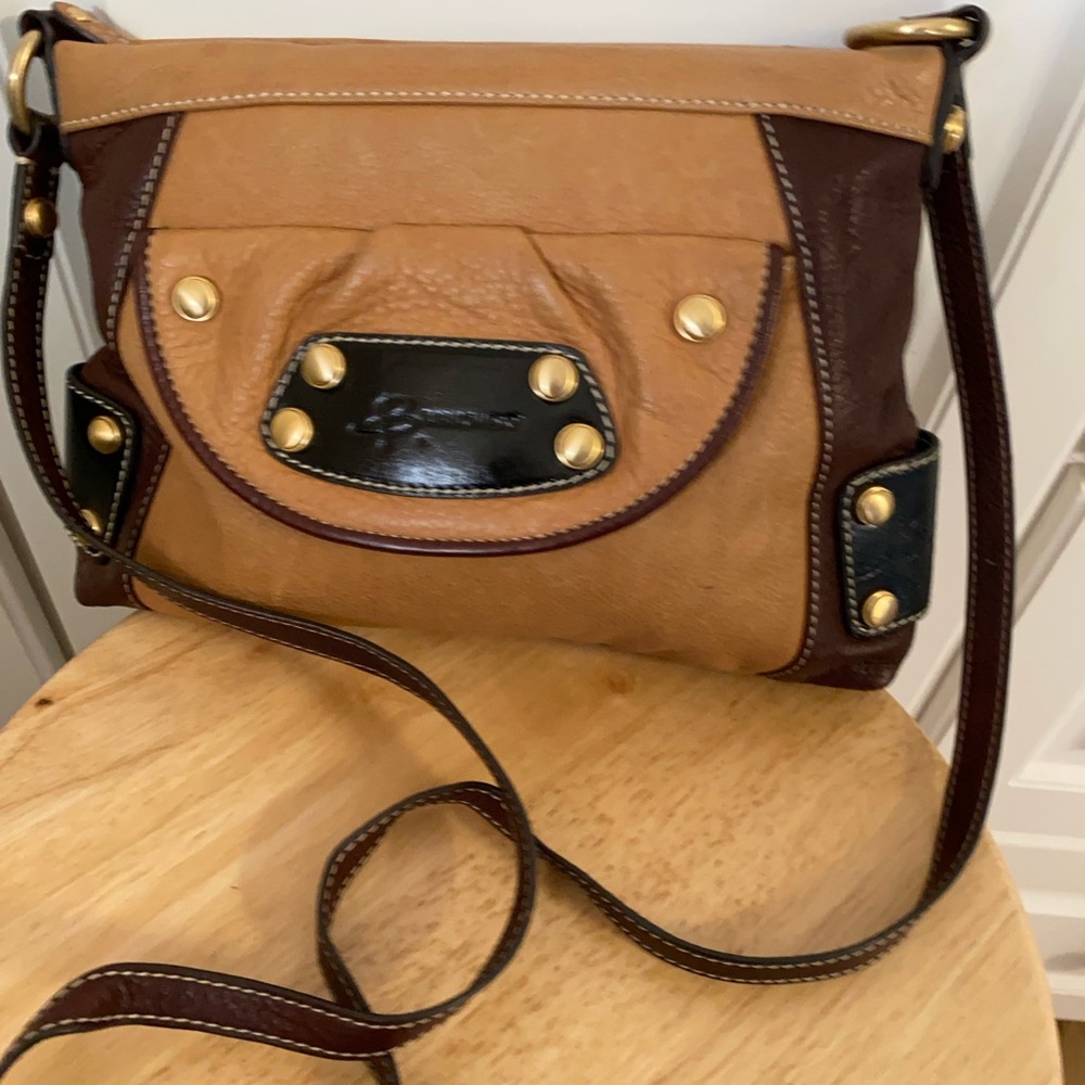 B.Makowsky womens bag slightly used with some tiny stained and scratched.